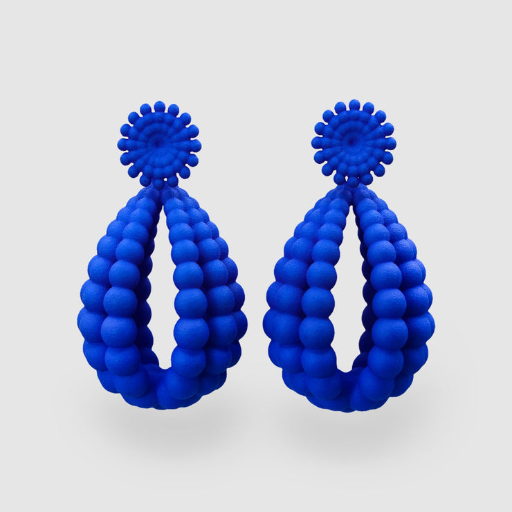 Show-stopping earrings from hand dyed durable plastic and silver .925 from the PHAOS collection. These earrings take center stage.