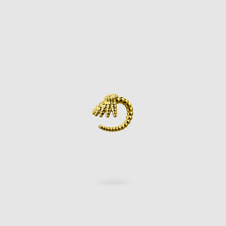 This finely detailed ear cuff from the PHAOS collection offers an innovative reinterpretation of the ancient granulation technique, brought to life through digital design and modern craftsmanship. Its sculptural form wraps elegantly around the ear without the need for a piercing, creating a bold yet refined statement. Available in your choice of gold-plated brass or .925 silver, it’s a contemporary piece that merges heritage with high-tech precision.