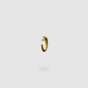 This sculptural ear cuff from the PHAOS collection reimagines the ancient granulation technique through digital design and contemporary craftsmanship. Designed to sit securely without a piercing, its fluid form curves around the ear and finishes with a luminous white glass pearl - adding a touch of shimmer to any look. Available in your choice of gold-plated brass or .925 silver.