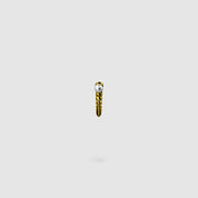 This sculptural ear cuff from the PHAOS collection reimagines the ancient granulation technique through digital design and contemporary craftsmanship. Designed to sit securely without a piercing, its fluid form curves around the ear and finishes with a luminous white glass pearl - adding a touch of shimmer to any look. Available in your choice of gold-plated brass or .925 silver.