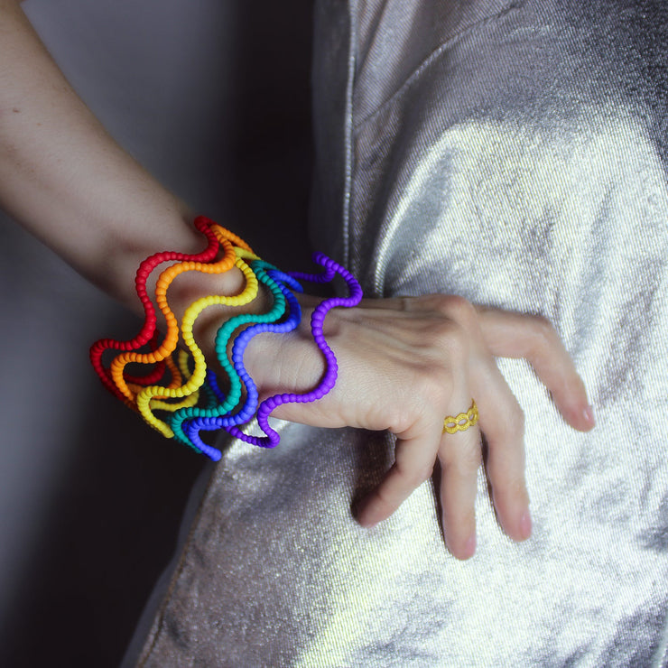 Set of 6 bangles 3D printed from bioplastic and hand-dyed in the sequence of hues commonly described as making up a rainbow; red, orange, yellow, green, blue, and violet. The bangles are available as a set or separately so you can choose the colour that best suits your personal style and personality.
