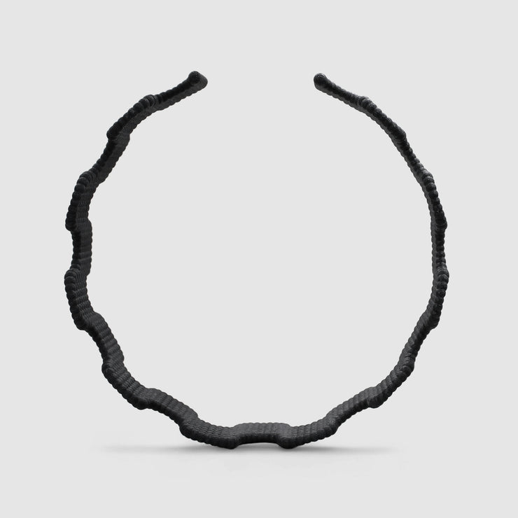 This statement chocker is crafted using advanced technology and hand finished in your choice of colour. Its material is a bioplastic polyamide powder made out of renewable resources that come from vegetable oil.