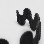 This statement chocker is crafted using advanced technology and hand finished in your choice of colour. Its material is a bioplastic polyamide powder made out of renewable resources that come from vegetable oil.