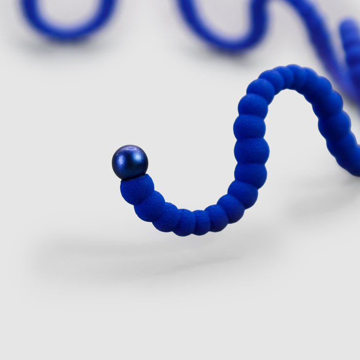 A contemporary statement piece, this choker is crafted from renewable bioplastic polyamide derived from vegetable oil and hand-finished in your choice of colour. Lightweight yet impactful, it sits elegantly at the neckline - striking in its simplicity.