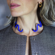 A contemporary statement piece, this choker is crafted from renewable bioplastic polyamide derived from vegetable oil and hand-finished in your choice of colour. Lightweight yet impactful, it sits elegantly at the neckline - striking in its simplicity.