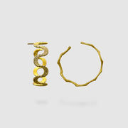 These intricate hoop earrings from the PHAOS collection are an innovative approach to the ancient technique of granulation, reimagined through digital design. Available in gold plated brass, silver .925 or gold plated silver .925 featuring our signature comfortable post fastening for pierced ears.