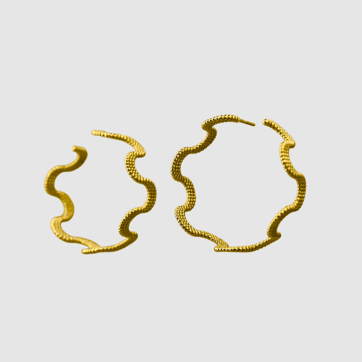 These intricate hoop earrings from the PHAOS collection are an innovative approach to the ancient technique of granulation, reimagined through digital design. Available in gold plated brass, silver .925 or gold plated silver .925 featuring our signature comfortable post fastening for pierced ears.