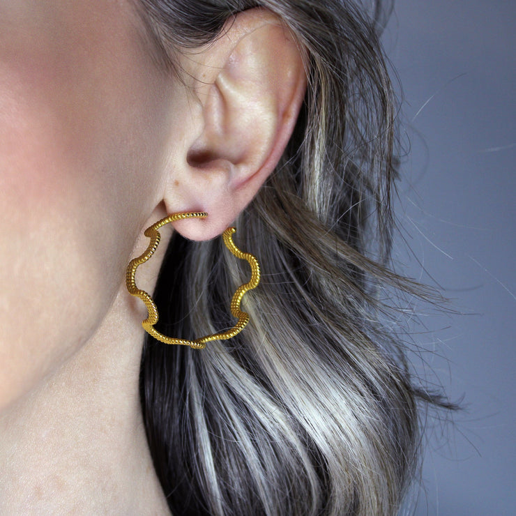 These intricate hoop earrings from the PHAOS collection are an innovative approach to the ancient technique of granulation, reimagined through digital design. Available in gold plated brass, silver .925 or gold plated silver .925 featuring our signature comfortable post fastening for pierced ears.