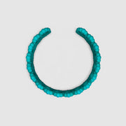 Turquoise cuff bracelet from the PHAOS collection, 3D printed in bioplastic, a polyamide powder made out of renewable resources that come from vegetable oil.