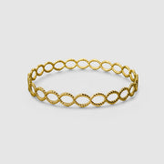 Delicate but daring bangle crafted in gold plated brass or silver .925 and powered by scientific inspiration. Stack this best-selling bracelet with others on a bare wrist, or wear it alone over a shirt sleeve for an elegant twist.