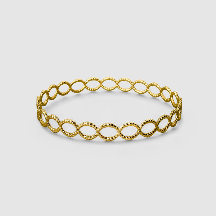 Delicate but daring bangle crafted in gold plated brass or silver .925 and powered by scientific inspiration. Stack this best-selling bracelet with others on a bare wrist, or wear it alone over a shirt sleeve for an elegant twist.