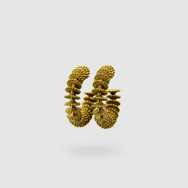 Our best selling hoop earrings from the PHAOS collection are crafted in gold plated brass, silver .925 or gold plated silver .925 and feature a playful yet delicate pattern. Decisively designed to enhance your everyday signature style. Finished with our signature post fastening for all-day comfort on pierced ears.