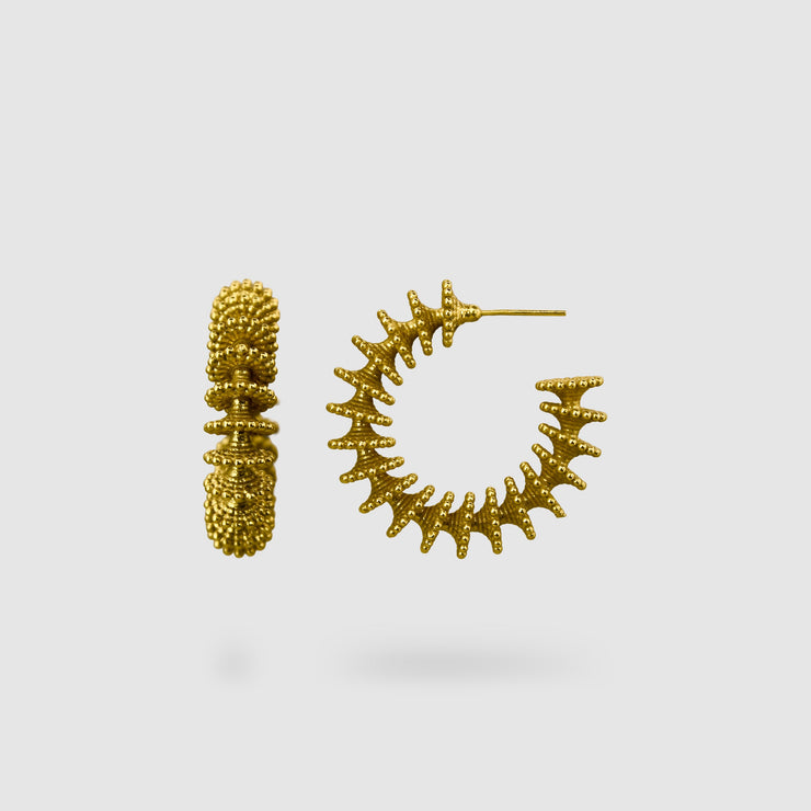 Our best selling hoop earrings from the PHAOS collection are crafted in gold plated brass, silver .925 or gold plated silver .925 and feature a playful yet delicate pattern. Decisively designed to enhance your everyday signature style. Finished with our signature post fastening for all-day comfort on pierced ears.