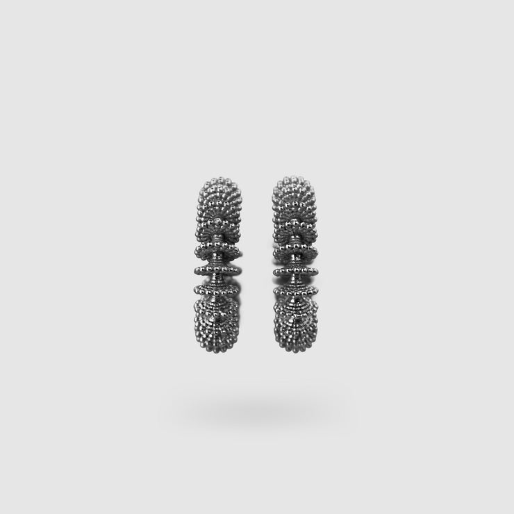 Our best selling hoop earrings from the PHAOS collection are crafted in gold plated brass, silver .925 or gold plated silver .925 and feature a playful yet delicate pattern. Decisively designed to enhance your everyday signature style. Finished with our signature post fastening for all-day comfort on pierced ears.