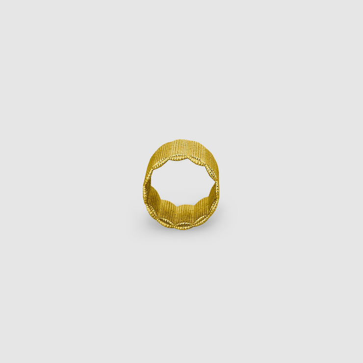 A seriously chunky ring from the PHAOS collection crafted in gold plated brass, silver .925 or gold plated silver .925. As this is a wide fitting ring, it’s always best to size up on your usual ring size. Featuring a contemporary twist to the ancient technique of granulation, it has a lovely feel and looks stunning on any finger.