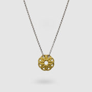 An artfully detailed pendant with a striking geometric form, crafted from gold-plated brass and paired with a .925 silver chain from the PHAOS collection. Make a subtle statement by layering it along with other pieces. Bold yet delicate, this pendant necklace makes the perfect gift.