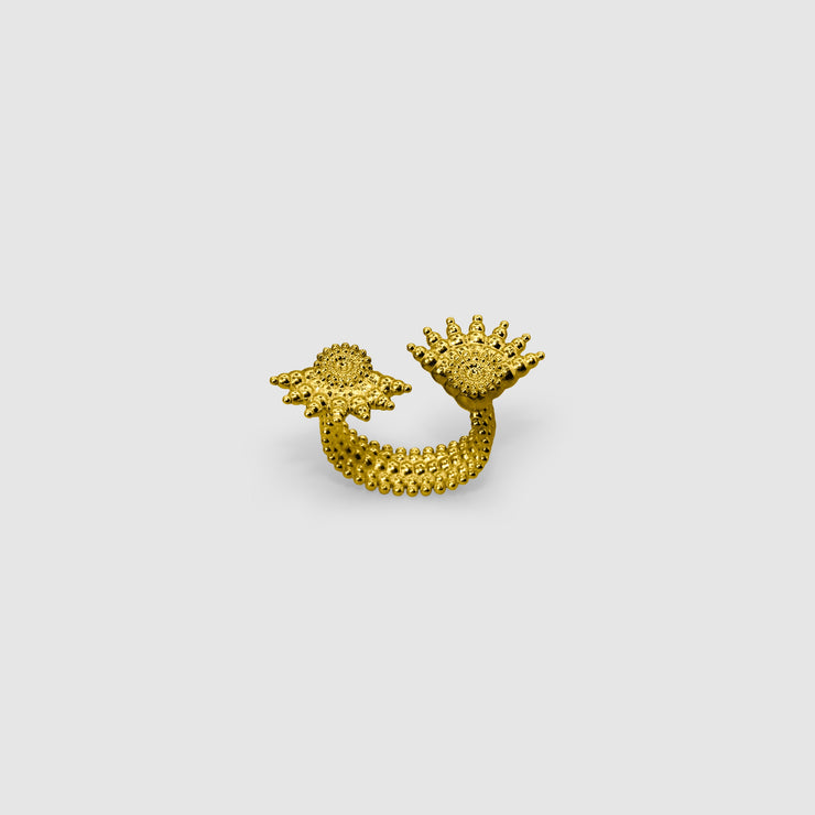 This open ring offers a bold, contemporary interpretation of the ancient granulation technique, blending heritage craftsmanship with modern design. Expertly crafted from gold-plated brass or .925 silver as part of the PHAOS collection, its sculptural form and textural detail make it a true statement piece.