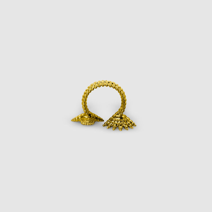 This open ring offers a bold, contemporary interpretation of the ancient granulation technique, blending heritage craftsmanship with modern design. Expertly crafted from gold-plated brass or .925 silver as part of the PHAOS collection, its sculptural form and textural detail make it a true statement piece.