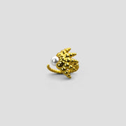 This open ring reimagines the ancient granulation technique with a fresh, contemporary edge, uniting heritage craftsmanship with modern design. Crafted in gold-plated brass or .925 silver as part of the PHAOS collection, it features an artful balance of form and texture, finished with a luminous glass bead for a distinctive statement.