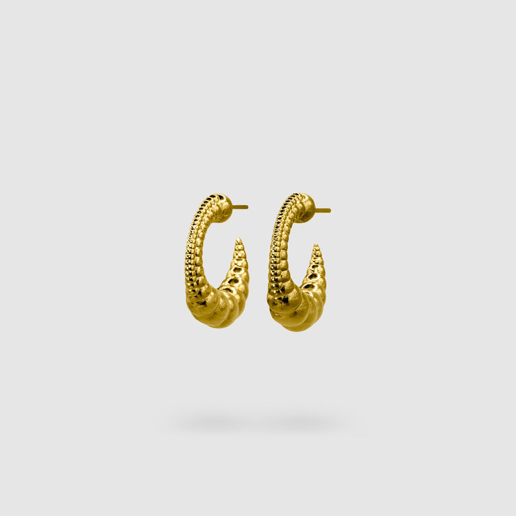 Expertly crafted from gold-plated brass or silver .925, these earrings strike the perfect balance between sophistication and sensuality with their sleek silhouette and minimalist design. If you gravitate toward earrings that are polished, daring, and effortlessly fashion-forward, then these are made for you.