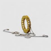 Striking yet refined, this pendant features an artfully detailed, geometric design crafted from gold-plated brass and suspended from a .925 silver chain - part of the PHAOS collection. Whether worn alone or layered with other pieces, it adds a subtle edge to any look. 