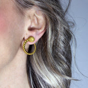 Sleek yet full of character, these wave hoop earrings from the PHAOS collection showcase a fluid, playful pattern with a refined touch. Available in gold-plated brass or .925 silver, they’re designed to add a hint of shine and movement to your everyday look. Finished with our signature post fastening for a secure, all-day comfortable fit on pierced ears.