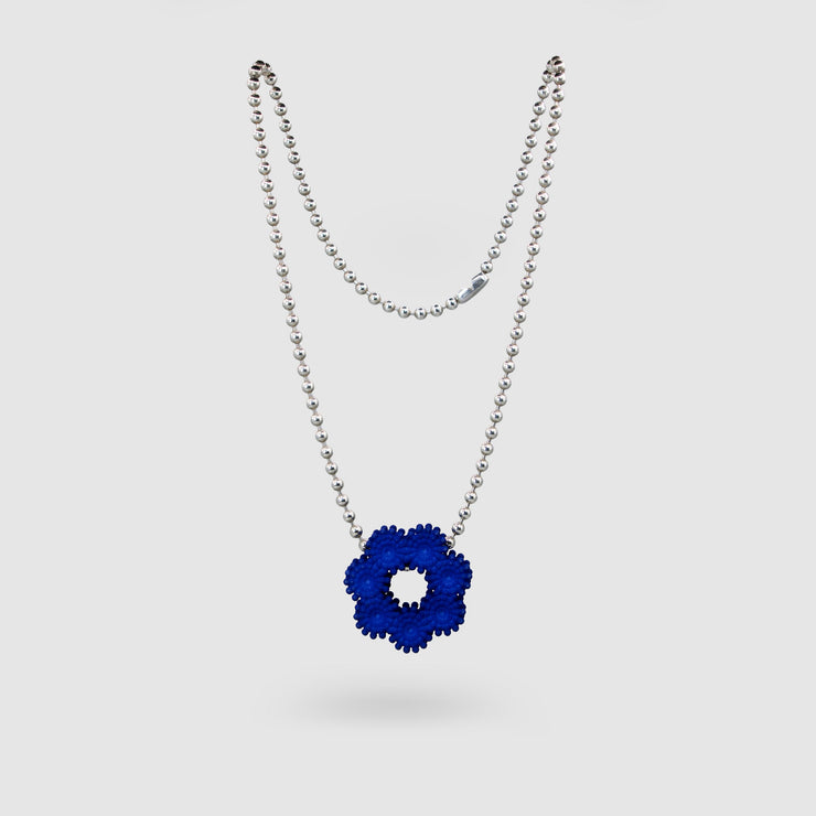 Contemporary and expressive, this pendant from the PHAOS collection showcases a detailed, geometric design crafted from bioplastic and suspended from a .925 silver chain. Wear it solo for a refined statement or layer it to elevate your daily style.
