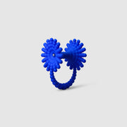 This eye-catching, geometric cocktail ring is 3D printed from a bioplastic made out of renewable resources that come from castor beans. Hand-dyed and finished with care, each piece features a subtle touch of .925 silver - a playful blend of tradition and forward-thinking design.