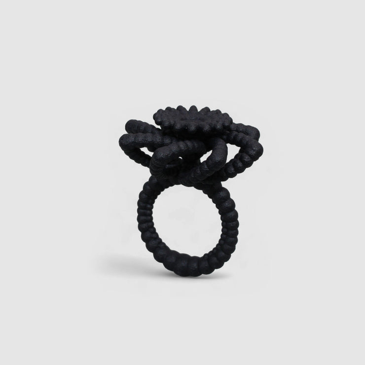 An expressive statement piece with a sculptural feel, this cocktail ring offers a contemporary take on the ancient art of granulation, brought to life through advanced 3D printing. It’s crafted from a strong, biosourced plastic and hand-dyed in your choice of colour.