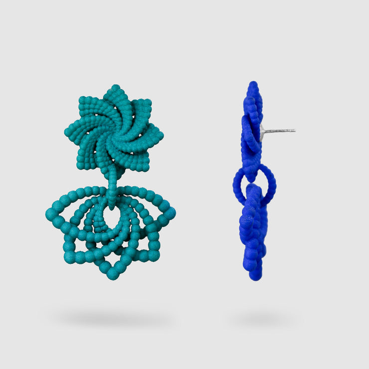 Feather-light and full of movement, these earrings are crafted from 3D-printed, hand-dyed bioplastic and finished with our signature .925 silver post fastening for a secure, all-day comfortable fit. Their bold geometric form makes a striking statement - perfectly balanced when paired with a crisp white shirt and clean, minimalist tailoring.