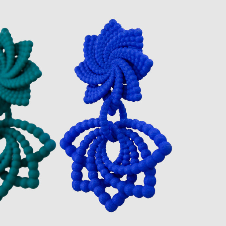 Feather-light and full of movement, these earrings are crafted from 3D-printed, hand-dyed bioplastic and finished with our signature .925 silver post fastening for a secure, all-day comfortable fit. Their bold geometric form makes a striking statement - perfectly balanced when paired with a crisp white shirt and clean, minimalist tailoring.