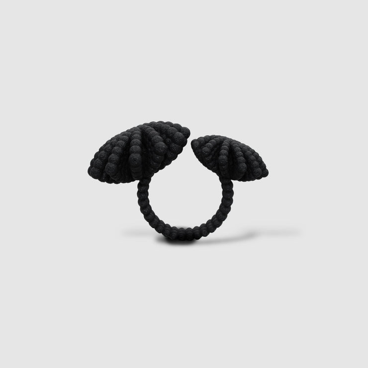 A bold statement piece with a sculptural edge, this open-band cocktail ring offers a contemporary take on the ancient art of granulation. 3D printed from a biosourced plastic known for its strength and distinctive sandy texture, each ring is hand-dyed and finished with care; a playful fusion of innovation and tradition.