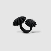A bold statement piece with a sculptural edge, this open-band cocktail ring offers a contemporary take on the ancient art of granulation. 3D printed from a biosourced plastic known for its strength and distinctive sandy texture, each ring is hand-dyed and finished with care; a playful fusion of innovation and tradition.
