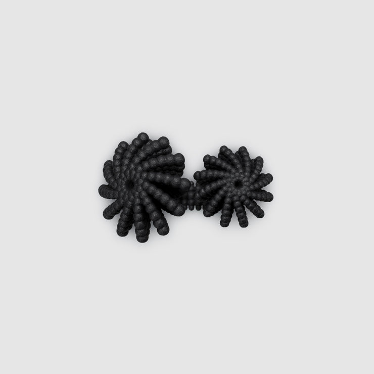 A bold statement piece with a sculptural edge, this open-band cocktail ring offers a contemporary take on the ancient art of granulation. 3D printed from a biosourced plastic known for its strength and distinctive sandy texture, each ring is hand-dyed and finished with care; a playful fusion of innovation and tradition.