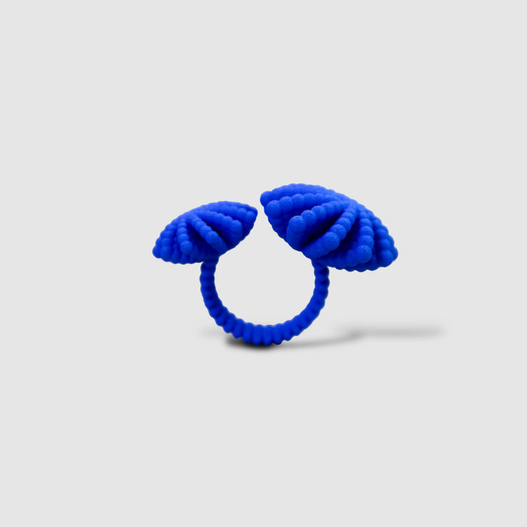 A bold statement piece with a sculptural edge, this open-band cocktail ring offers a contemporary take on the ancient art of granulation. 3D printed from a biosourced plastic known for its strength and distinctive sandy texture, each ring is hand-dyed and finished with care; a playful fusion of innovation and tradition.