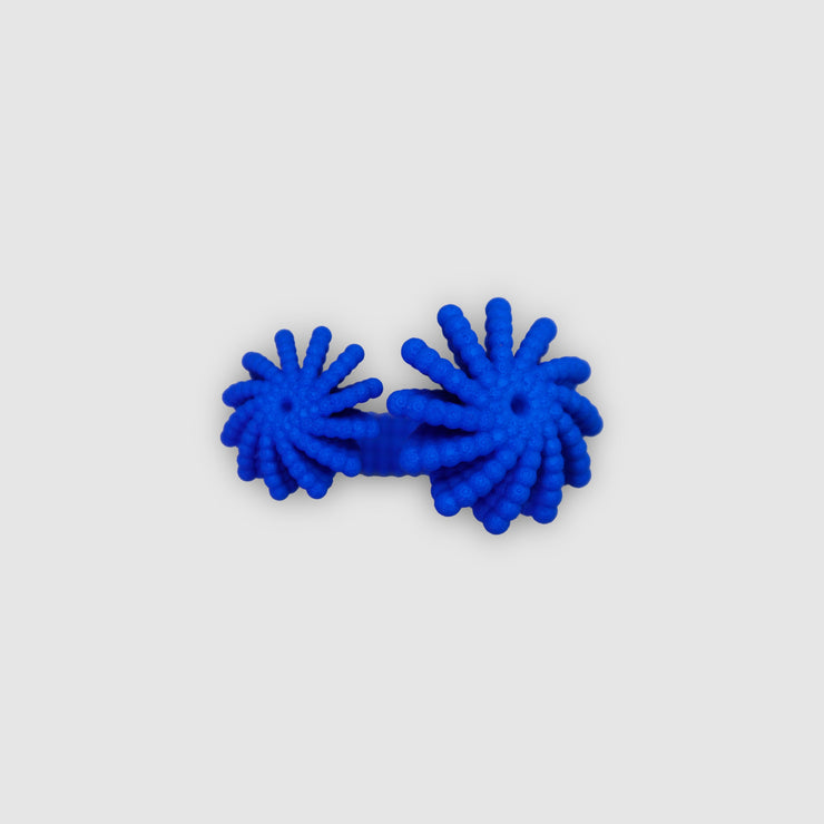 A bold statement piece with a sculptural edge, this open-band cocktail ring offers a contemporary take on the ancient art of granulation. 3D printed from a biosourced plastic known for its strength and distinctive sandy texture, each ring is hand-dyed and finished with care; a playful fusion of innovation and tradition.