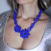 This ultimate statement of a necklace is the latest addition to the collection, crafted from durable bioplastic and hand dyed in your choice of colour. It features a silver .925 closure, adjusting the total length to best fit your look. From a white T-shirt to your favourite little-black-dress, this piece can dress up any outfit.