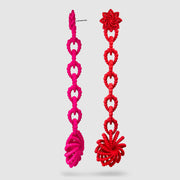 Crafted from ultra-light, 3D-printed bioplastic, these head-turning earrings are a true statement piece. Part of the captivating PHAOS collection, they feature a hand-dyed finish - one in bold red, the other in vibrant pink - bringing a playful contrast to any look. Finished with our signature post fastening for all-day comfort on pierced ears.