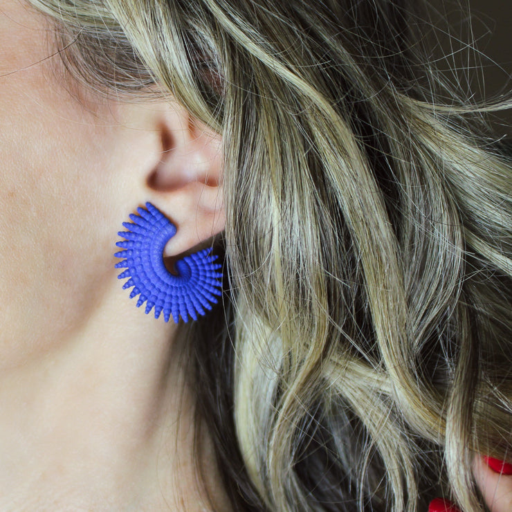 Intricate, vibrant, and easy-to-wear, this pair of pierced earrings adds a dash of colour to any outfit. Created with selective laser sintering technology from bioplastic, which is a biosourced strong material that has a sandy look, these earrings are hand finished with colour dye and our signature post fastening for all-day comfort on pierced ears.