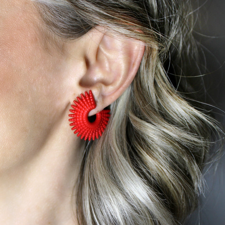 Intricate, vibrant, and easy-to-wear, this pair of pierced earrings adds a dash of colour to any outfit. Created with selective laser sintering technology from bioplastic, which is a biosourced strong material that has a sandy look, these earrings are hand finished with colour dye and our signature post fastening for all-day comfort on pierced ears.