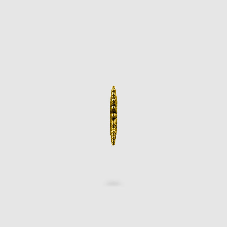 This sophisticated ear cuff from the PHAOS collection reimagines the ancient granulation technique through digital design and contemporary craftsmanship. Designed to sit securely without a piercing, its geometric shape curves around the ear. Available in your choice of gold-plated brass or .925 silver.