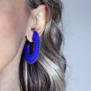 Crafted from ultra-light 3D printed bioplastic, these sculptural earrings bring a touch of playful sophistication to any look. Part of the enchanting PHAOS collection, each pair is hand-dyed in a vibrant palette, creating a sense of movement and intrigue. Secured with our signature .925 silver post fastening for lasting comfort on pierced ears.