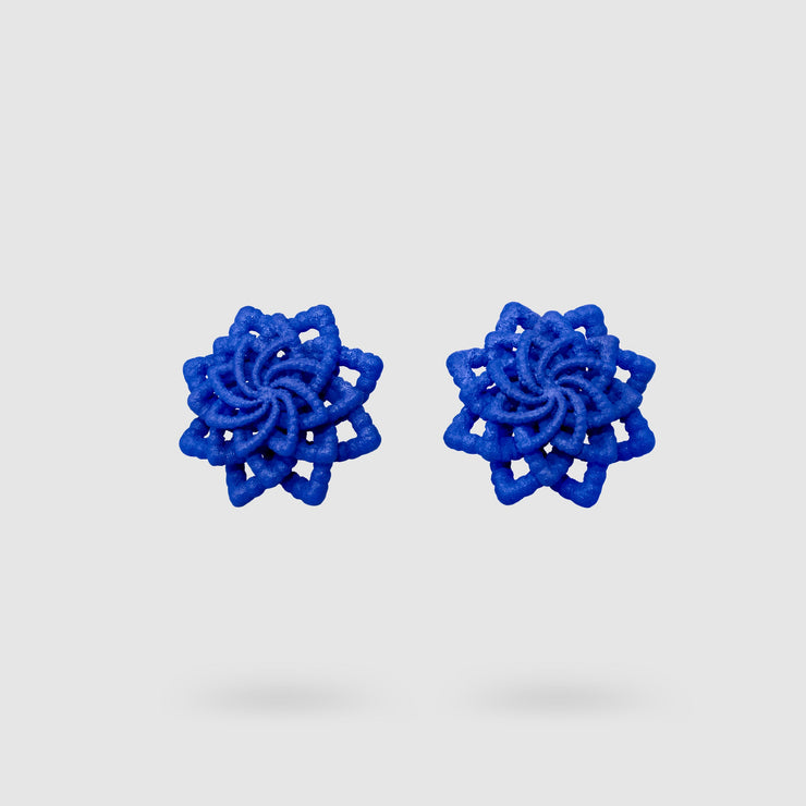 Striking and refined, these contemporary stud earrings are a vibrant reinterpretation of the ancient granulation technique, brought into the future through cutting-edge design. Crafted using selective laser sintering, each pair is made from durable, sand-textured bioplastic and hand-dyed for a rich burst of colour. Finished with our signature .925 silver post fastenings, they’re lightweight, easy to wear, and perfect for adding a touch of modern artistry to any look.
