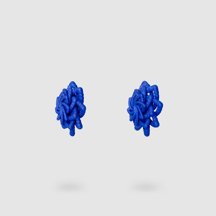 Striking and refined, these contemporary stud earrings are a vibrant reinterpretation of the ancient granulation technique, brought into the future through cutting-edge design. Crafted using selective laser sintering, each pair is made from durable, sand-textured bioplastic and hand-dyed for a rich burst of colour. Finished with our signature .925 silver post fastenings, they’re lightweight, easy to wear, and perfect for adding a touch of modern artistry to any look.