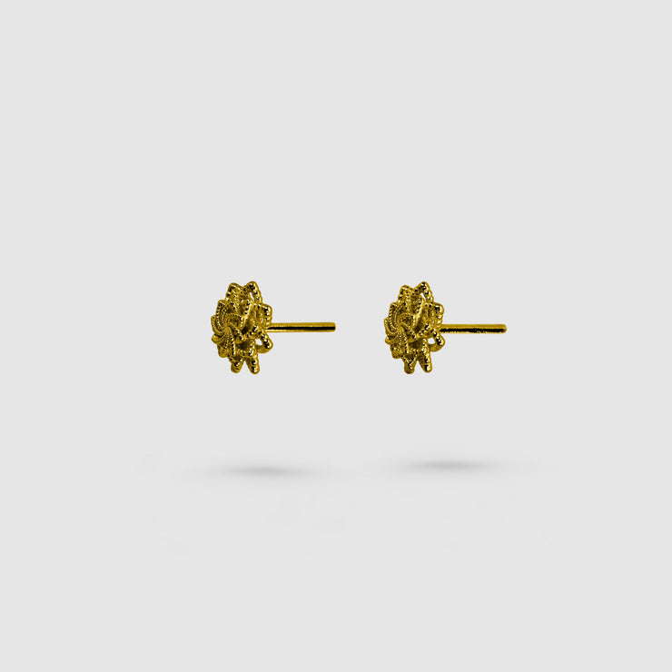 Delicate yet distinctive, these tiny stud earrings offer a modern take on a timeless form, inspired by the ancient art of granulation. Thoughtfully crafted in your choice of gold-plated brass or .925 silver, they’re versatile enough to elevate any look - whether worn alone or layered for added impact.