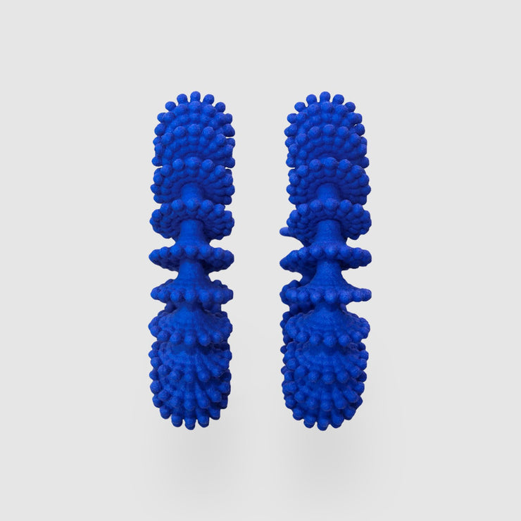 These chunky but ultra light hoops from the PHAOS collection are created with the use of advanced digital technology and hand dyed in royal blue. Wear them to bring a touch of vibrant colour to simple T-shirts sweatshirts and hoodies.
