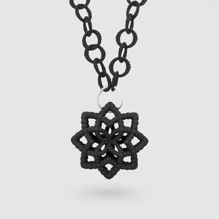 An interweaving standout this 2 in 1 necklace is crafted from durable nylon and hand dyed in black. It features a circular silver .925 closure which holds the pendant and can be deconstructed to a long minimalist chain necklace hence 2 in 1!